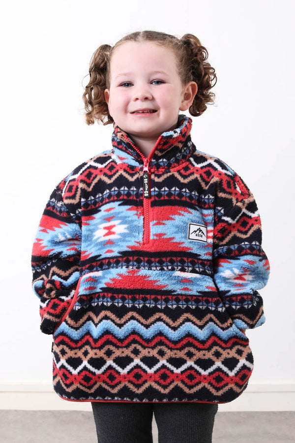 The snuggle Kid's Fleece in coral aztec